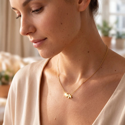 Woman Wearing Gold Minimalist Initial Heart Letter Necklace