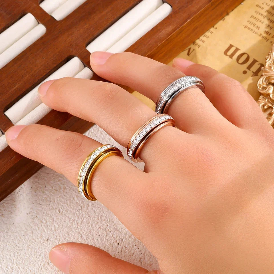 Person wearing a spinner ring as a tactile alternative to cuticle picking