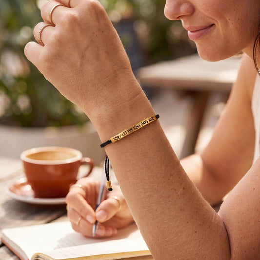 Woman wearing waterproof motivational reminder cord bracelet daily