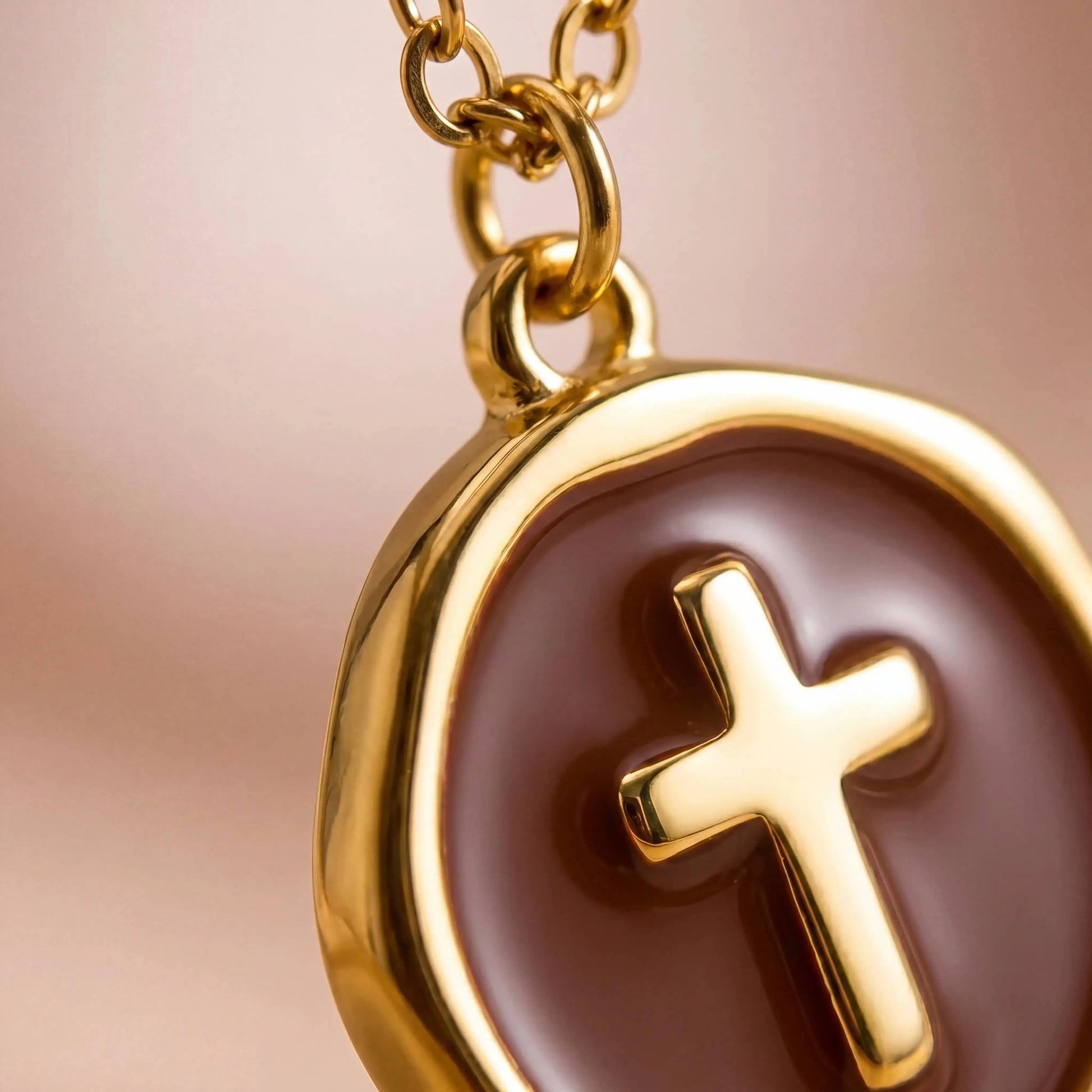 Close-up Detail of Brown Enamel Gold Cross Pendant Charm