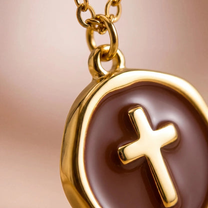 Close-up Detail of Brown Enamel Gold Cross Pendant Charm