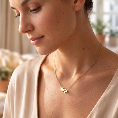 Woman Wearing Gold Minimalist Initial Heart Letter Necklace