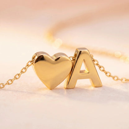 Close-up Detail of Gold Heart and Letter A Pendant Charms