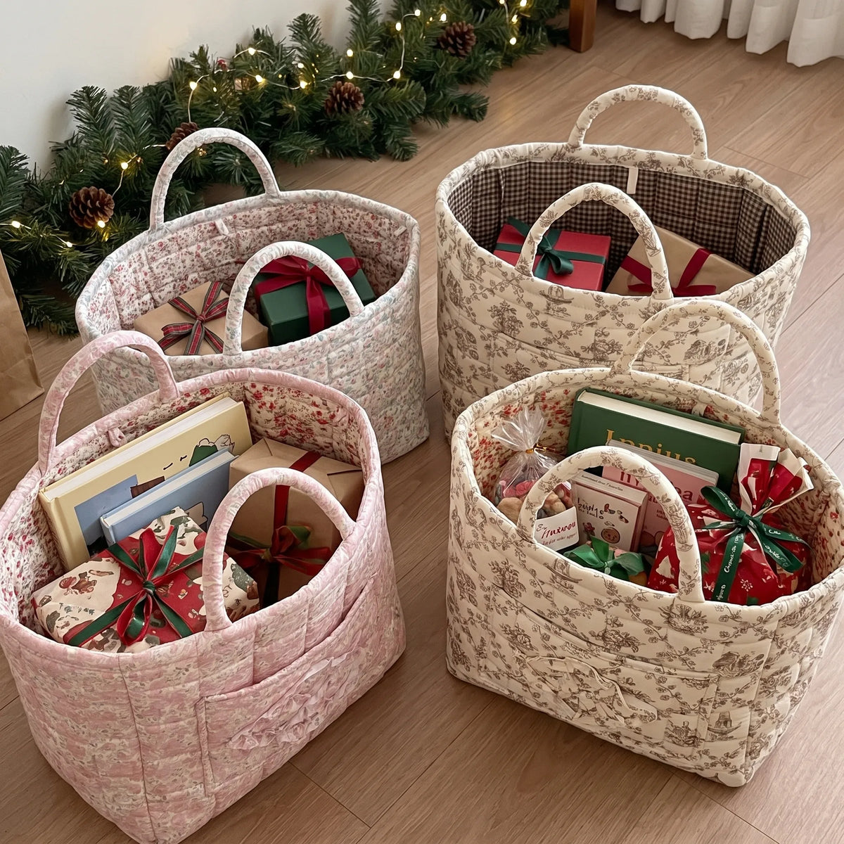 Four quilted baskets in different prints filled with wrapped gifts